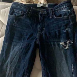 Stressed mid rise skinny jeans